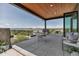 Relaxing outdoor patio offering views of mountains and countryside, perfect for entertaining guests at 202 October Pl, Castle Rock, CO 80104