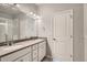 Double vanity bathroom with a shower at 6942 Huddersfield Ln, Castle Pines, CO 80108