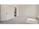 Bright bedroom with carpet flooring and access to a bathroom at 6942 Huddersfield Ln, Castle Pines, CO 80108