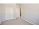 Bright bedroom with double closet and neutral carpeting at 6942 Huddersfield Ln, Castle Pines, CO 80108