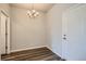 Simple dining room with hardwood floors and a chandelier at 6942 Huddersfield Ln, Castle Pines, CO 80108