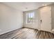 Light and bright foyer with wood-look floors and a view of the backyard at 6942 Huddersfield Ln, Castle Pines, CO 80108