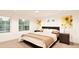 Comfortable bedroom with large windows, stylish decor, and a relaxing atmosphere at 22361 E 38Th Pl, Aurora, CO 80019