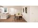 Bright dining room features contemporary decor, natural light, and access to the kitchen at 22361 E 38Th Pl, Aurora, CO 80019