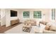 Comfortable living room with stylish furnishings, natural light, and sleek media console at 22361 E 38Th Pl, Aurora, CO 80019