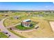 An aerial shot of a home on a large lot, complete with a workshop, garden, recreational vehicle, and serene surroundings at 177 W 8Th Ave, Byers, CO 80103