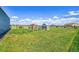 Lush backyard featuring a chicken coop and ample green space for outdoor enjoyment at 177 W 8Th Ave, Byers, CO 80103