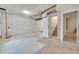 Unfinished basement with white walls, concrete floor, and visible ceiling pipes at 177 W 8Th Ave, Byers, CO 80103