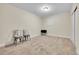Finished basement area with neutral carpet, chairs, and a closet at 177 W 8Th Ave, Byers, CO 80103