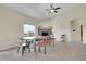 Bright dining area with large window, fireplace, and stylish furniture at 177 W 8Th Ave, Byers, CO 80103