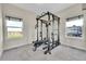 Exercise room featuring weight training equipment and a large window at 177 W 8Th Ave, Byers, CO 80103