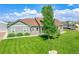 Charming single-Gathering home featuring a well-manicured lawn, mature trees, and a recreational vehicle at 177 W 8Th Ave, Byers, CO 80103