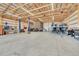 Large garage with car lift, storage, and plenty of space for hobbies and projects at 177 W 8Th Ave, Byers, CO 80103
