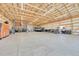 Spacious garage featuring high ceilings, ample storage, and car lifts for the automotive enthusiast at 177 W 8Th Ave, Byers, CO 80103