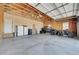 Spacious garage with concrete floor, door to the outside, and room for recreational vehicles at 177 W 8Th Ave, Byers, CO 80103