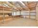 Well-lit garage with shelving and workspace, perfect for storage and DIY projects at 177 W 8Th Ave, Byers, CO 80103