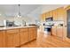 Eat-in kitchen featuring stainless steel appliances, granite countertops and hardwood floors at 177 W 8Th Ave, Byers, CO 80103