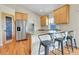 Bright kitchen with stainless steel appliances, breakfast bar and granite countertops at 177 W 8Th Ave, Byers, CO 80103