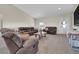 Bright living room with vaulted ceilings, comfortable seating, and plenty of natural light at 177 W 8Th Ave, Byers, CO 80103