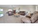 Spacious living room with vaulted ceilings, plush carpeting, and modern fireplace at 177 W 8Th Ave, Byers, CO 80103