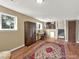 Spacious basement featuring wood-look flooring, a desk, and a large cabinet at 1565 S Helena Cir, Aurora, CO 80017