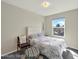 Bright bedroom features neutral walls and a cozy chair at 1565 S Helena Cir, Aurora, CO 80017