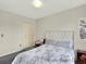 Bedroom featuring an upholstered headboard, neutral walls, and modern decor at 1565 S Helena Cir, Aurora, CO 80017