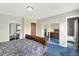 Spacious bedroom with ample closet space, plush carpeting, and a view into the well-appointed bathroom at 1565 S Helena Cir, Aurora, CO 80017