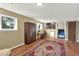 Spacious living room featuring wood floors, a large rug, and a staircase leading to another level at 1565 S Helena Cir, Aurora, CO 80017
