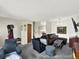 Living room featuring neutral paint, comfortable seating, and modern decor at 1565 S Helena Cir, Aurora, CO 80017