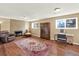 Inviting living room with a brick fireplace, plush seating, and bright windows with lots of space at 1565 S Helena Cir, Aurora, CO 80017