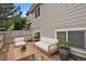 Cozy backyard patio with modern outdoor seating and neutral siding at 1276 S Zeno Cir # A, Aurora, CO 80017
