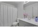 Clean bathroom featuring a shower with white curtain, vanity, and mirror at 1276 S Zeno Cir # A, Aurora, CO 80017