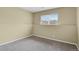 Bedroom featuring neutral paint, grey carpet, and natural light from the window at 1276 S Zeno Cir # A, Aurora, CO 80017