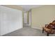 Bedroom view showcasing a large closet, neutral walls and carpet, and an additional doorway at 1276 S Zeno Cir # A, Aurora, CO 80017