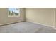 Empty bedroom with carpet and natural light from the window at 1276 S Zeno Cir # A, Aurora, CO 80017