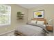 Bright bedroom with natural light, floating shelves, and modern decor at 1276 S Zeno Cir # A, Aurora, CO 80017