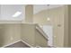 Hallway features natural lighting from a skylight and neutral colors at 1276 S Zeno Cir # A, Aurora, CO 80017
