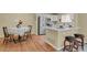 Modern kitchen with stainless steel appliances, a breakfast bar, and sleek countertops at 1276 S Zeno Cir # A, Aurora, CO 80017
