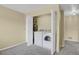 Modern laundry closet with a new white front-loading washer and dryer at 1276 S Zeno Cir # A, Aurora, CO 80017