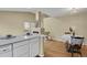 Bright space featuring the kitchen, eating area, and fireplace at 1276 S Zeno Cir # A, Aurora, CO 80017