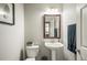 Simple bathroom with pedestal sink and toilet at 677 N 48Th Ave, Brighton, CO 80601