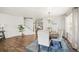 Open concept dining room with hardwood floors and staircase at 677 N 48Th Ave, Brighton, CO 80601