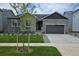 Charming single-Gathering home featuring a well-manicured lawn, stone accents, and an attached two-car garage at 2536 Lupton Ln, Lafayette, CO 80026
