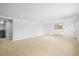 Unfinished basement with concrete walls, carpeting, and a small window at 7250 W Vassar Ave, Lakewood, CO 80227