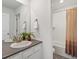 Well-lit bathroom with a single vanity and a bathtub shower combo at 1649 Marquette Aly, Erie, CO 80516
