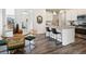 Cozy dining area with stylish chairs and a view into the kitchen with bar seating at 1649 Marquette Aly, Erie, CO 80516