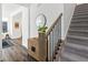 Bright entryway with wood floors, a staircase, and stylish decor at 1649 Marquette Aly, Erie, CO 80516