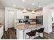 Bright kitchen with granite countertops, stainless steel appliances, and a breakfast bar at 1649 Marquette Aly, Erie, CO 80516