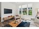 Stylish living room with contemporary furnishings and bright natural lighting at 1649 Marquette Aly, Erie, CO 80516